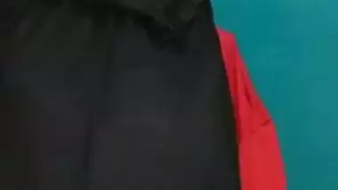Desi female in a long black skirt exposes legs and boobies in sex show
