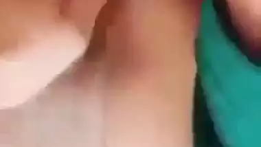 Horny girl squeezes her boobs and fingers her hairy pussy