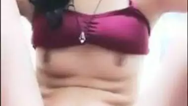 Desi whore in red top and panties broadcasts solo XXX show close-up