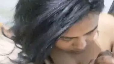 GF with smiling face gives blowjob to boyfriend